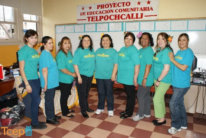 Nine women stand in a semicircle. School board member Yesenia Lopez is on the far left. The photo is from 2012.
